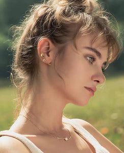 Golden cutlery and diamond earrings